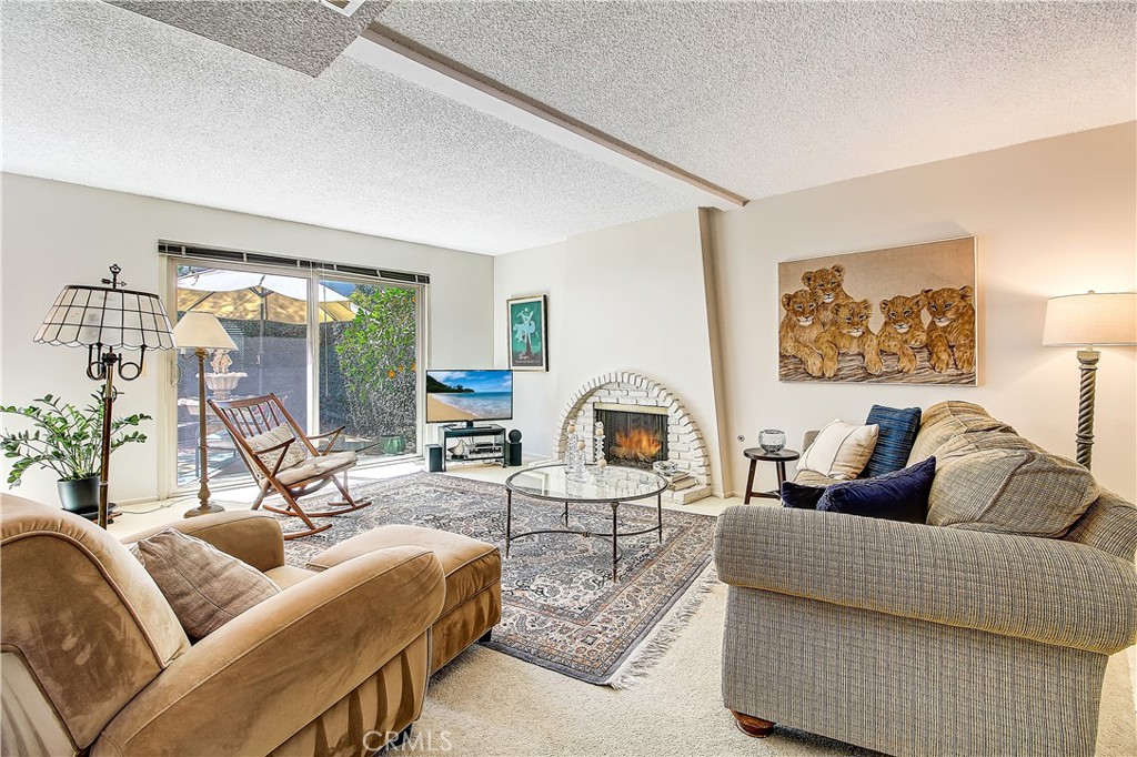 6618 Wintertree Drive Riverside, CA 92506 - Photo 8 of 37 a living room with furniture and a large window