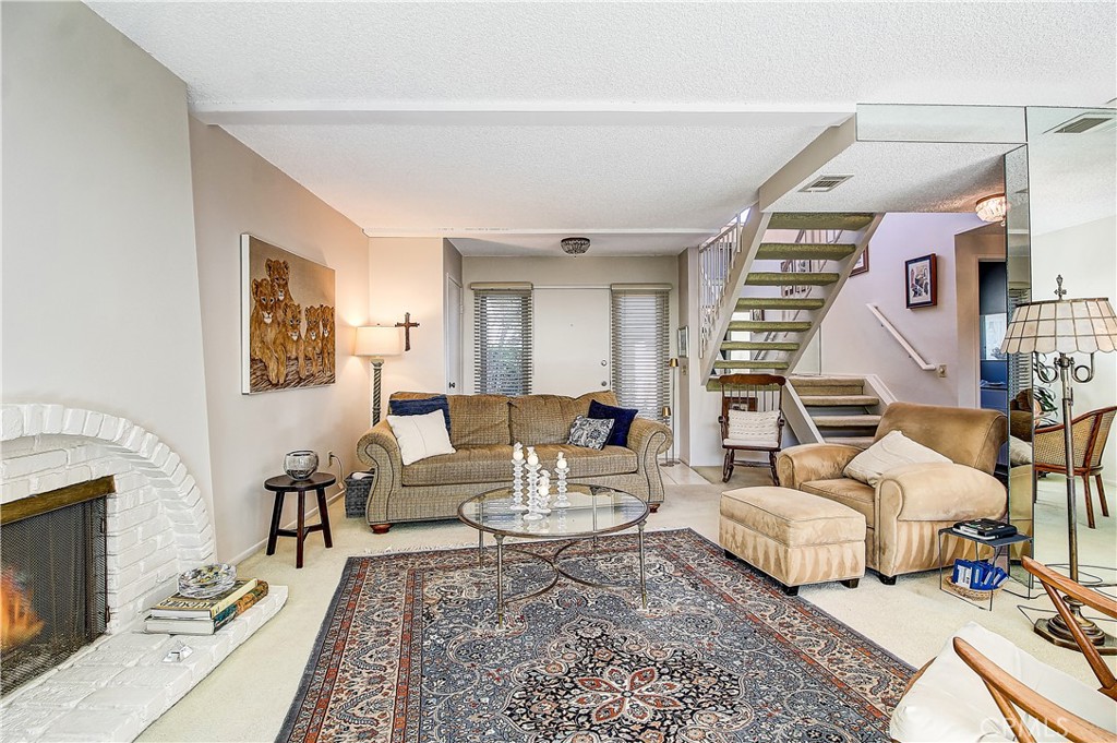 6618 Wintertree Drive Riverside, CA 92506 - Photo 10 of 37 a living room with furniture and a fireplace