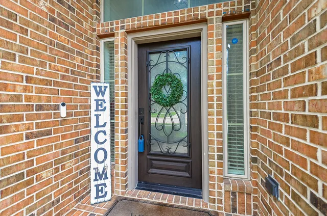 a view of a door and a window