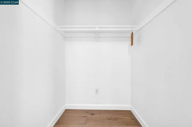 an aerial view of a house with a yard and garden