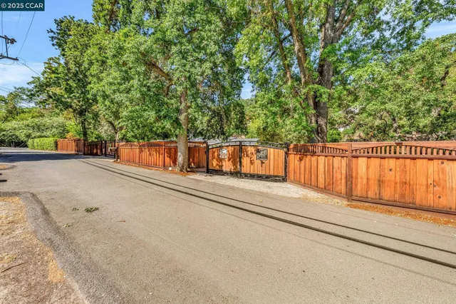 a view of a street with trees in the background