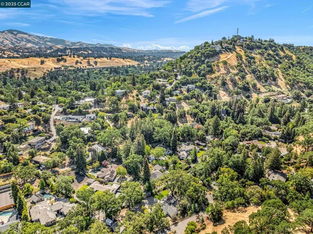 a view of a livingroom with a ceiling fan and window