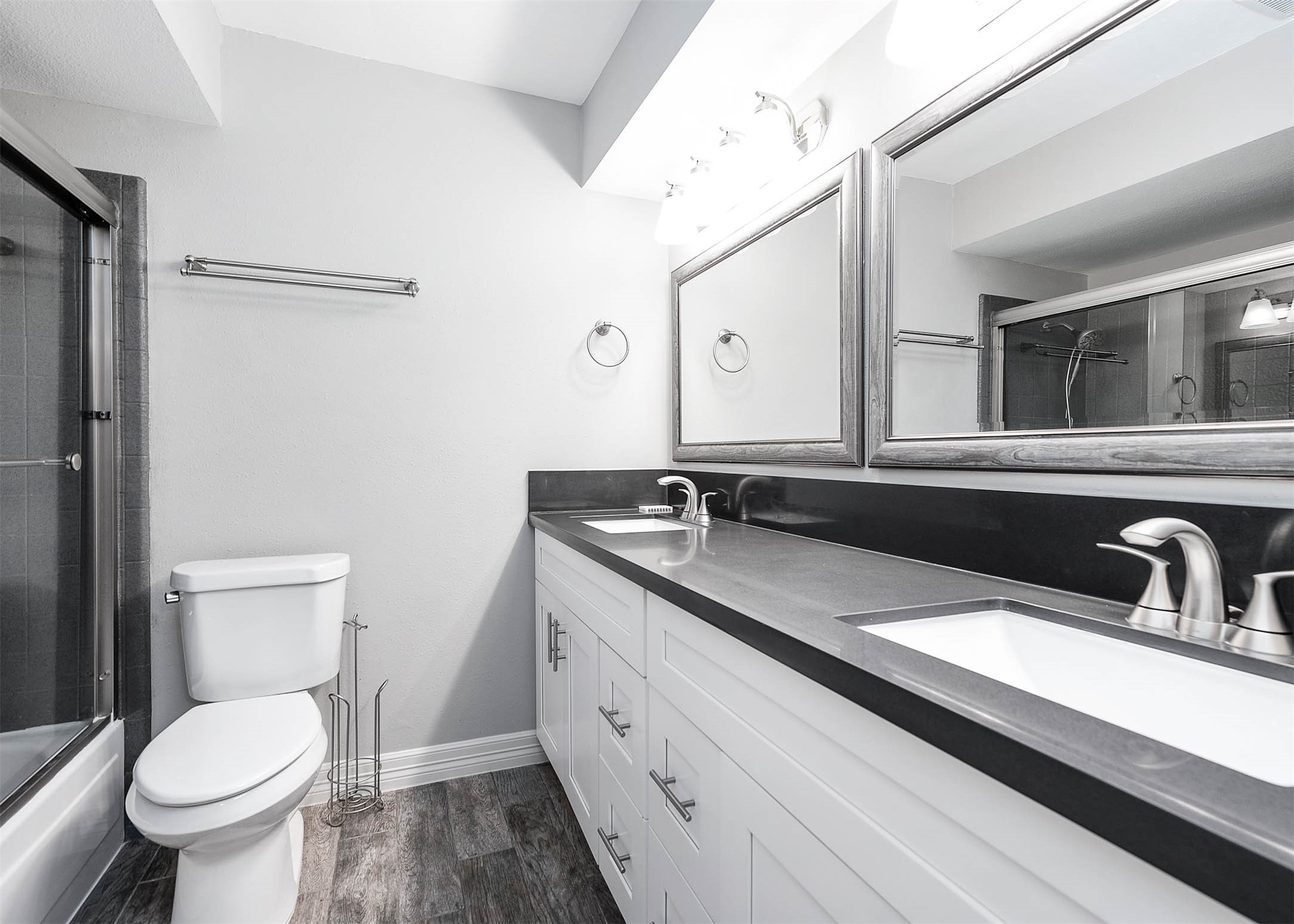 5528 Beverly Hill Street, Unit 1 Houston, TX 77056 - Photo 16 of 22 a bathroom with a toilet sink and mirror