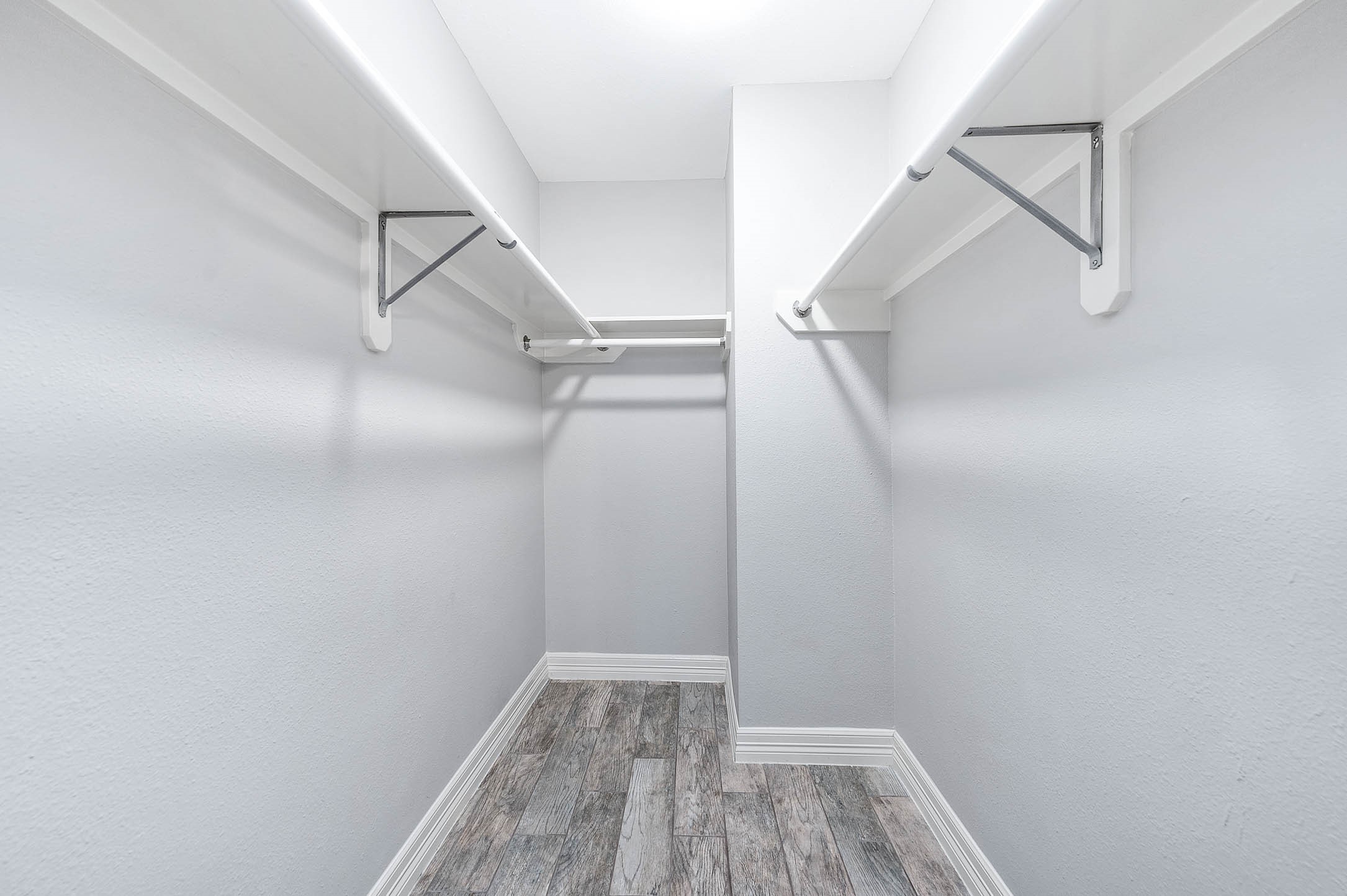 5528 Beverly Hill Street, Unit 1 Houston, TX 77056 - Photo 20 of 22 a view of walk in closet with empty racks
