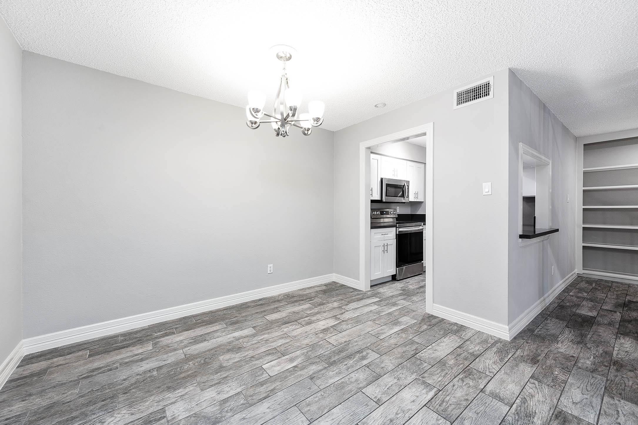 5528 Beverly Hill Street, Unit 1 Houston, TX 77056 - Photo 5 of 22 a view of a kitchen with refrigerator and an oven