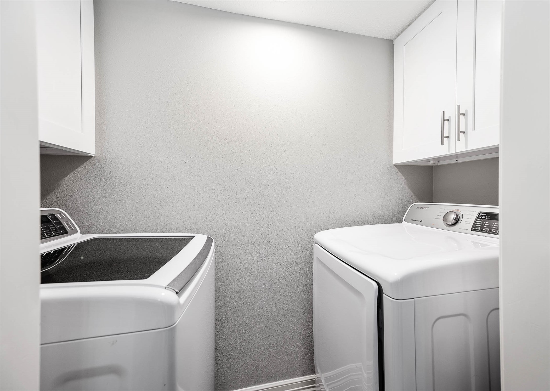 5528 Beverly Hill Street, Unit 1 Houston, TX 77056 - Photo 10 of 22 a utility room with dryer and washer