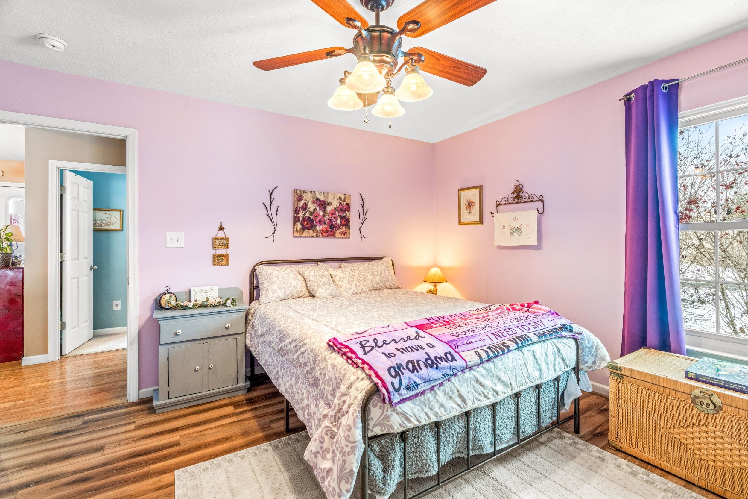 901 Ritchie Boulevard Staunton, VA 24401 - Photo 16 of 36 a bedroom with a bed and a chandelier