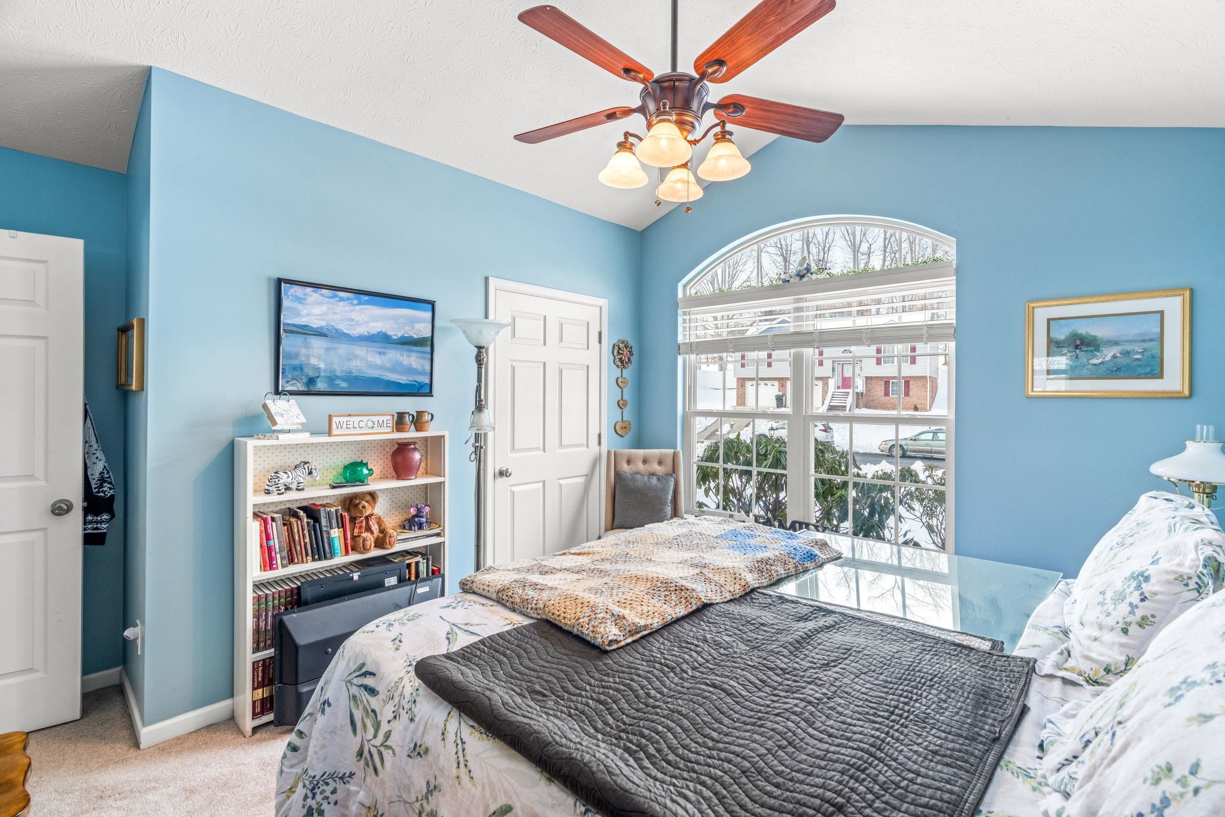 901 Ritchie Boulevard Staunton, VA 24401 - Photo 18 of 36 a bedroom with a bed and a large window with the outer view