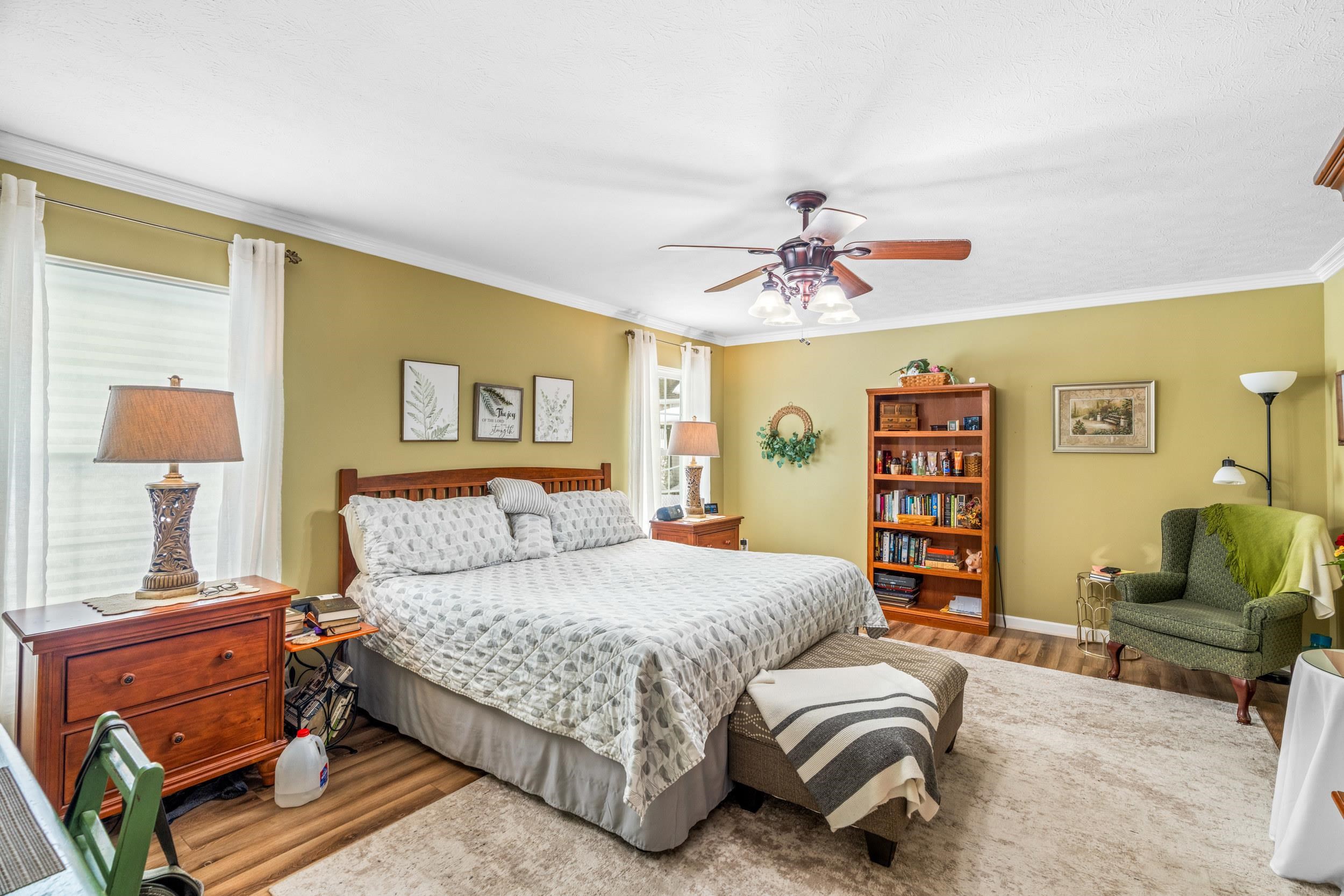 901 Ritchie Boulevard Staunton, VA 24401 - Photo 23 of 36 a bedroom with a bed a couch and a chandelier