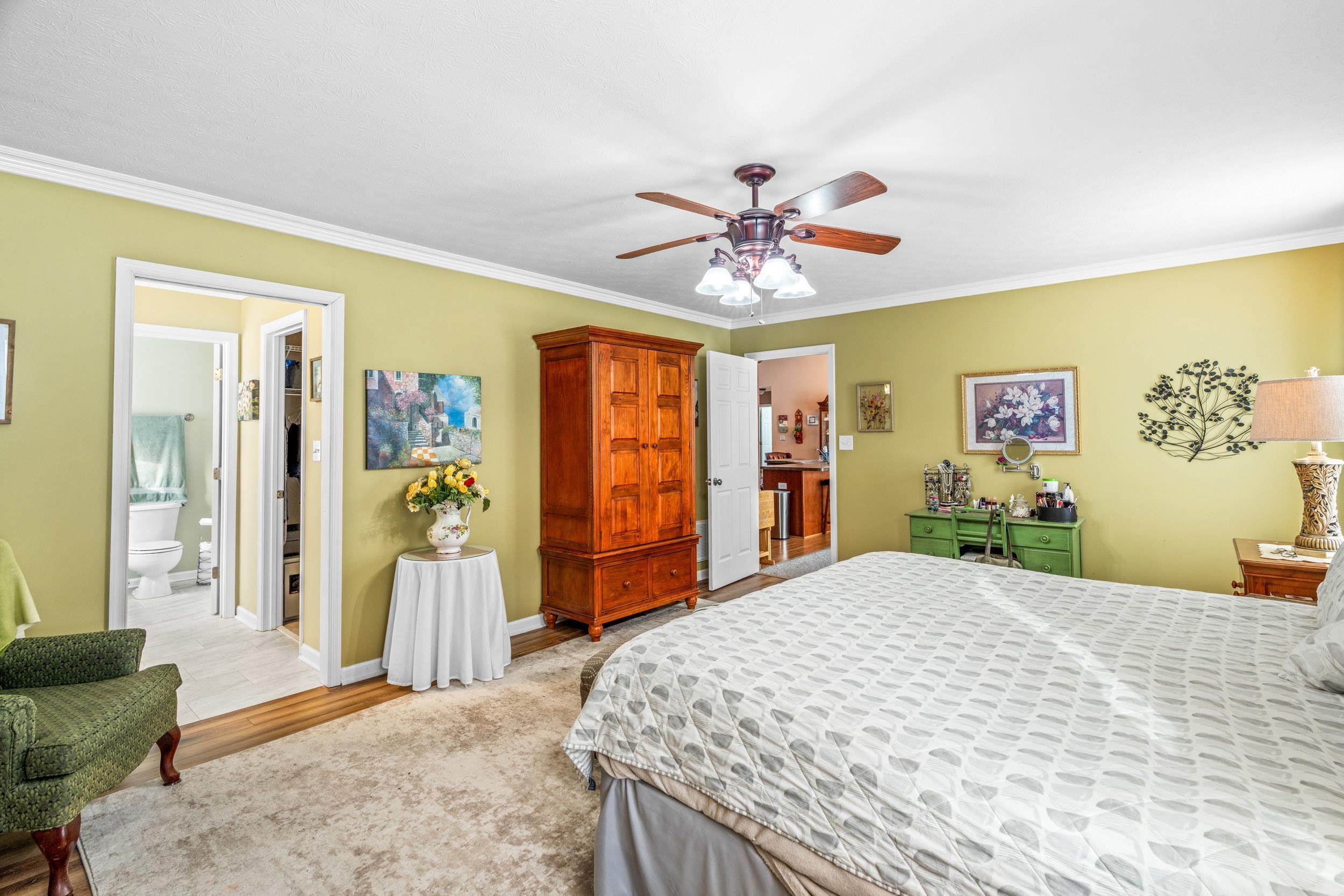 901 Ritchie Boulevard Staunton, VA 24401 - Photo 26 of 36 a bedroom with a bed and a chandelier