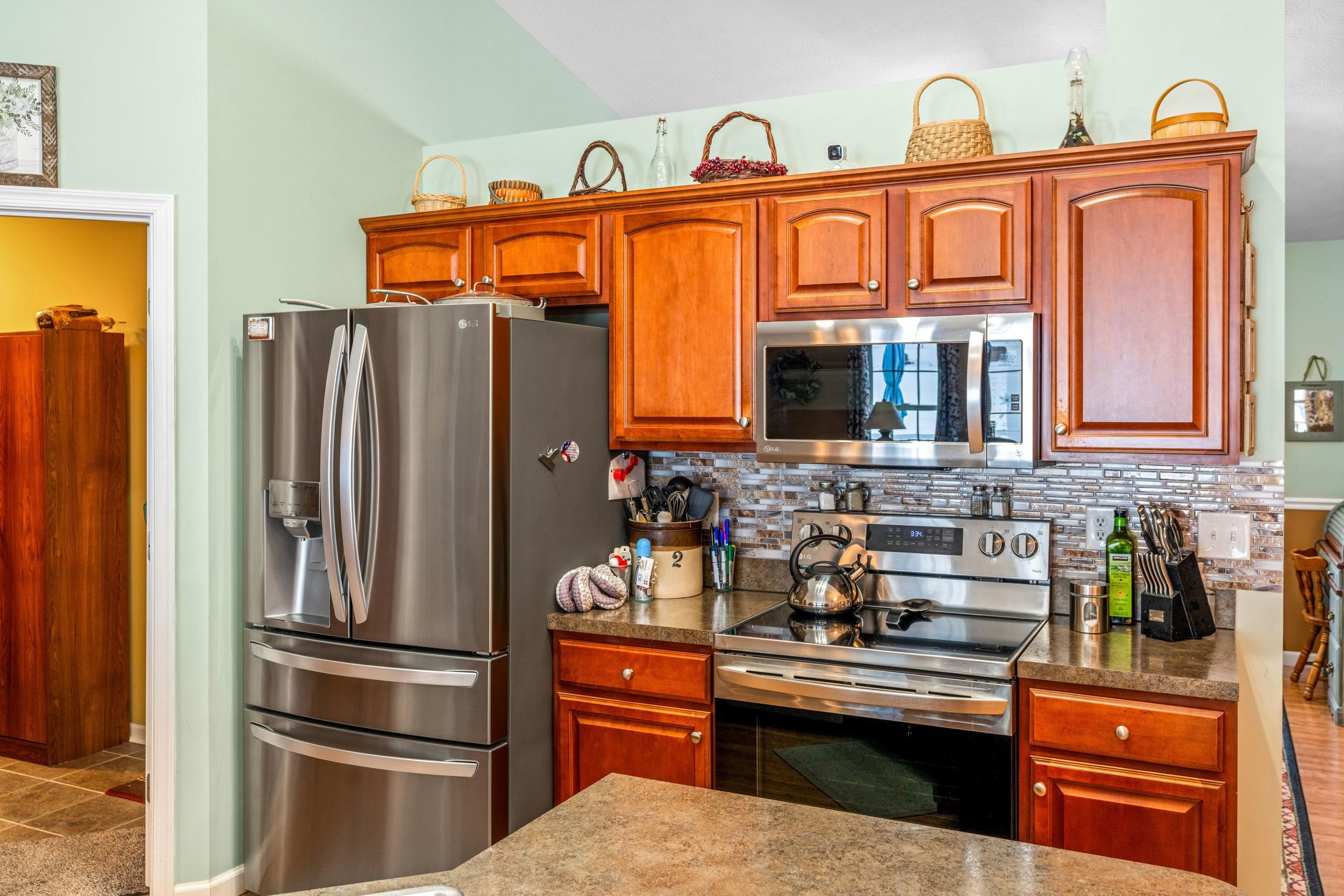 901 Ritchie Boulevard Staunton, VA 24401 - Photo 5 of 36 a kitchen with stainless steel appliances granite countertop a refrigerator and a stove top oven