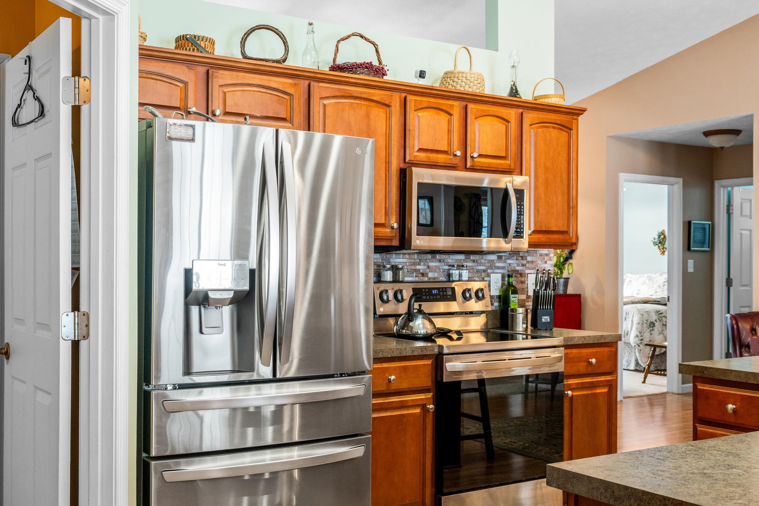 901 Ritchie Boulevard Staunton, VA 24401 - Photo 7 of 36 a kitchen with stainless steel appliances granite countertop a refrigerator and a stove top oven