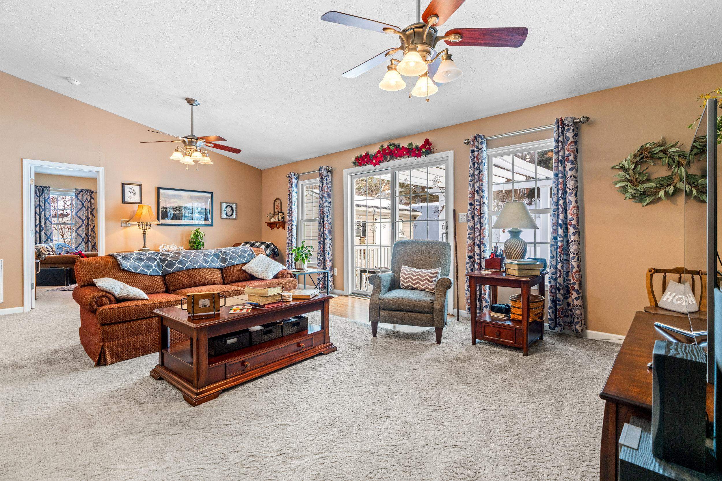 901 Ritchie Boulevard Staunton, VA 24401 - Photo 9 of 36 a living room with furniture a chandelier and a flat screen tv