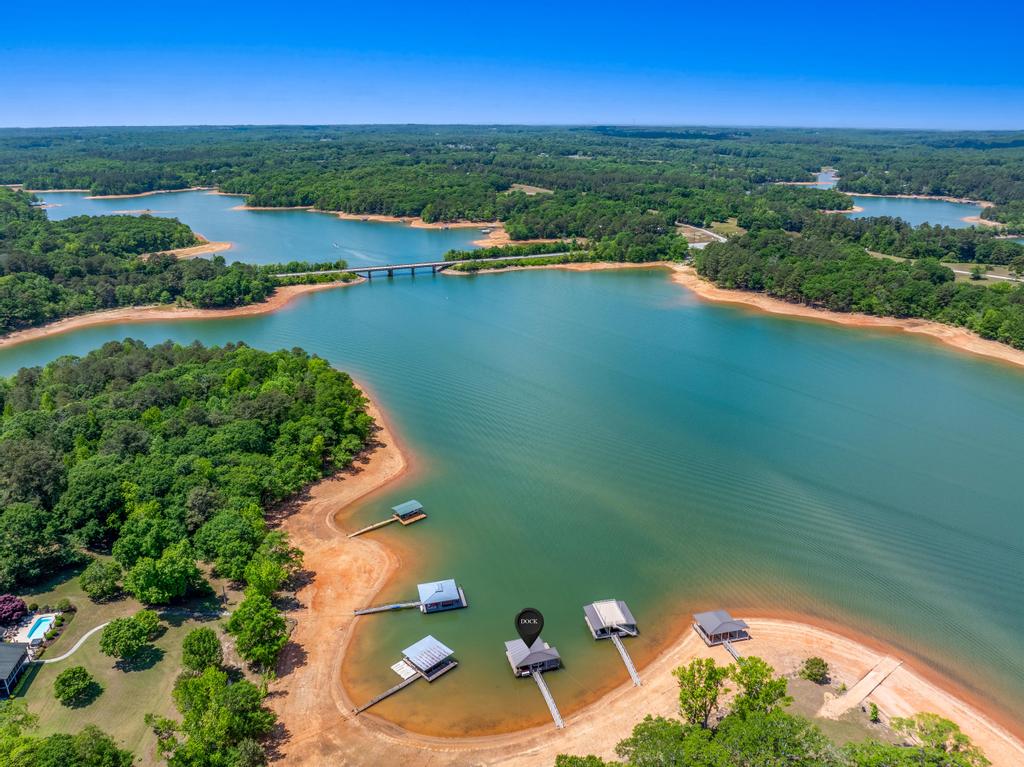 707 Vickery Street Extension Hartwell, GA 30643 - Photo 50 of 50 Overlooking serene waters, this expansive lakefront property features multiple private boat docks for ultimate aquatic enjoyment.