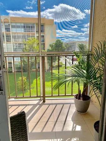 a bedroom with a bed and a night stand