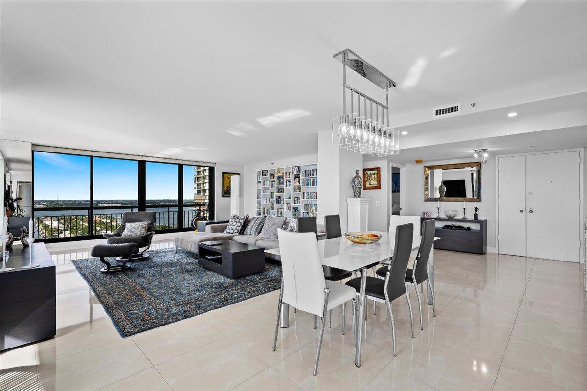 4000 North Ocean Drive, Unit 2004 Singer Island, FL 33404 - Photo 14 of 54 a view of a dining room with furniture window and wooden floor