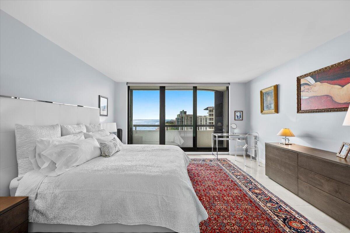 4000 North Ocean Drive, Unit 2004 Singer Island, FL 33404 - Photo 18 of 54 a large bedroom with a bed and glass windows
