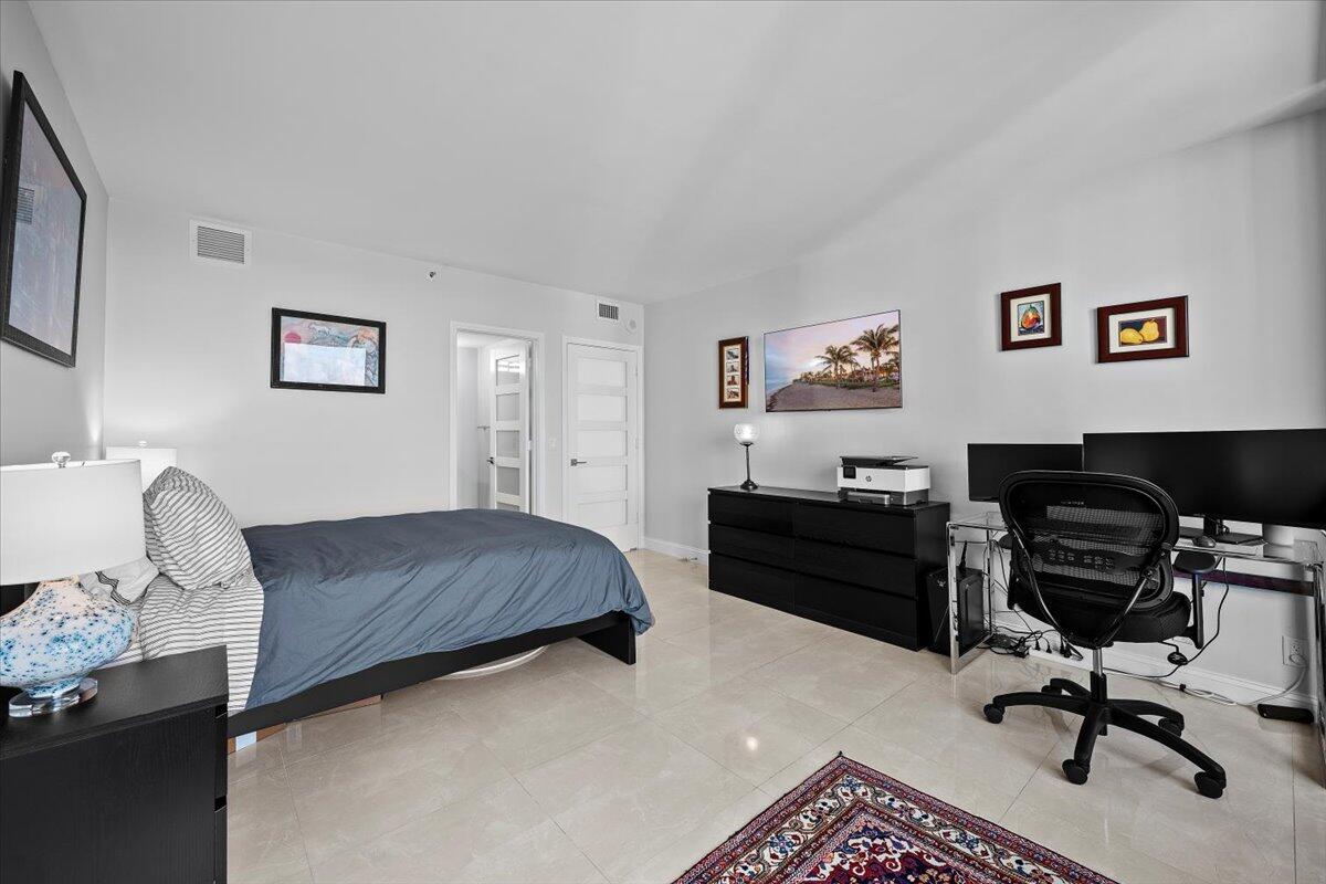 4000 North Ocean Drive, Unit 2004 Singer Island, FL 33404 - Photo 20 of 54 a bedroom with a bed and furniture