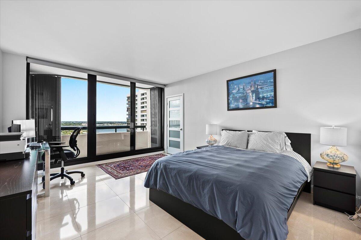 4000 North Ocean Drive, Unit 2004 Singer Island, FL 33404 - Photo 23 of 54 a bedroom with a large bed and a large window