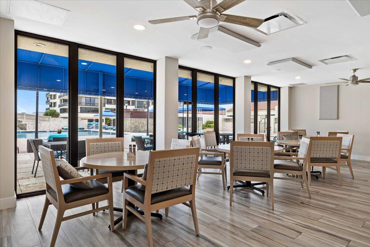 4000 North Ocean Drive, Unit 2004 Singer Island, FL 33404 - Photo 29 of 54 a dining room with furniture window and wooden floor