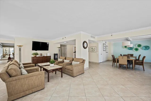 a dinning room and kitchen view with a large window