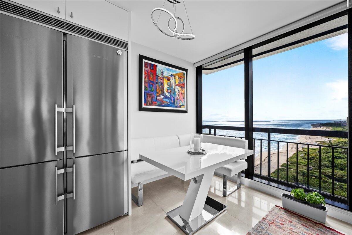 4000 North Ocean Drive, Unit 2004 Singer Island, FL 33404 - Photo 4 of 54 a view of a dining room with furniture window and wooden floor