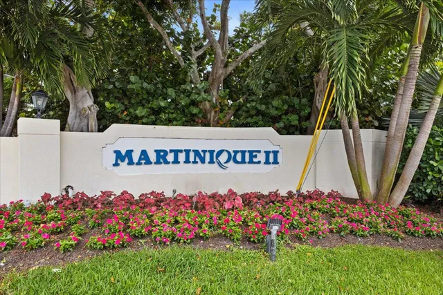 a view of a swimming pool with an outdoor seating