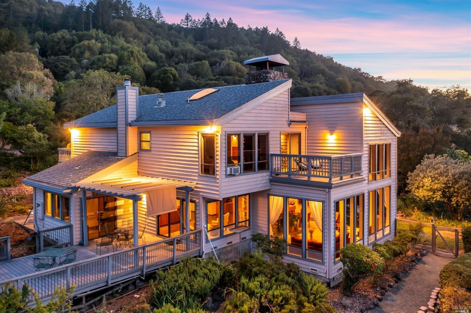 4716 Bennett Valley Road Santa Rosa, CA 95404 - Photo 1 of 1 An abundance of light filtering windows illuminate the home at night and provide spectacular views.