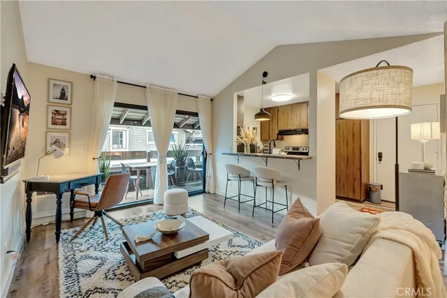 a living room with furniture fireplace and a flat screen tv
