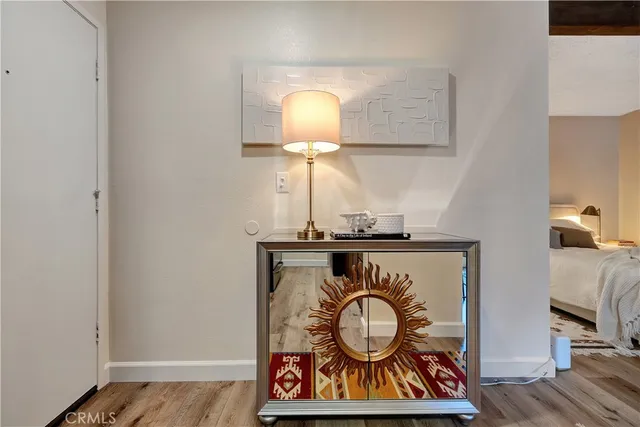 a view of light fixtures and wooden floor