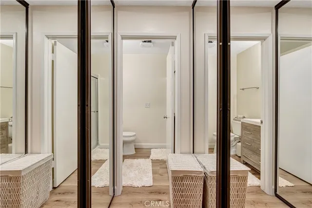 a view of a bathroom from a hallway