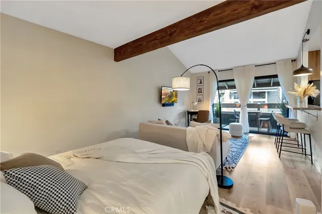 a bedroom with bed and window