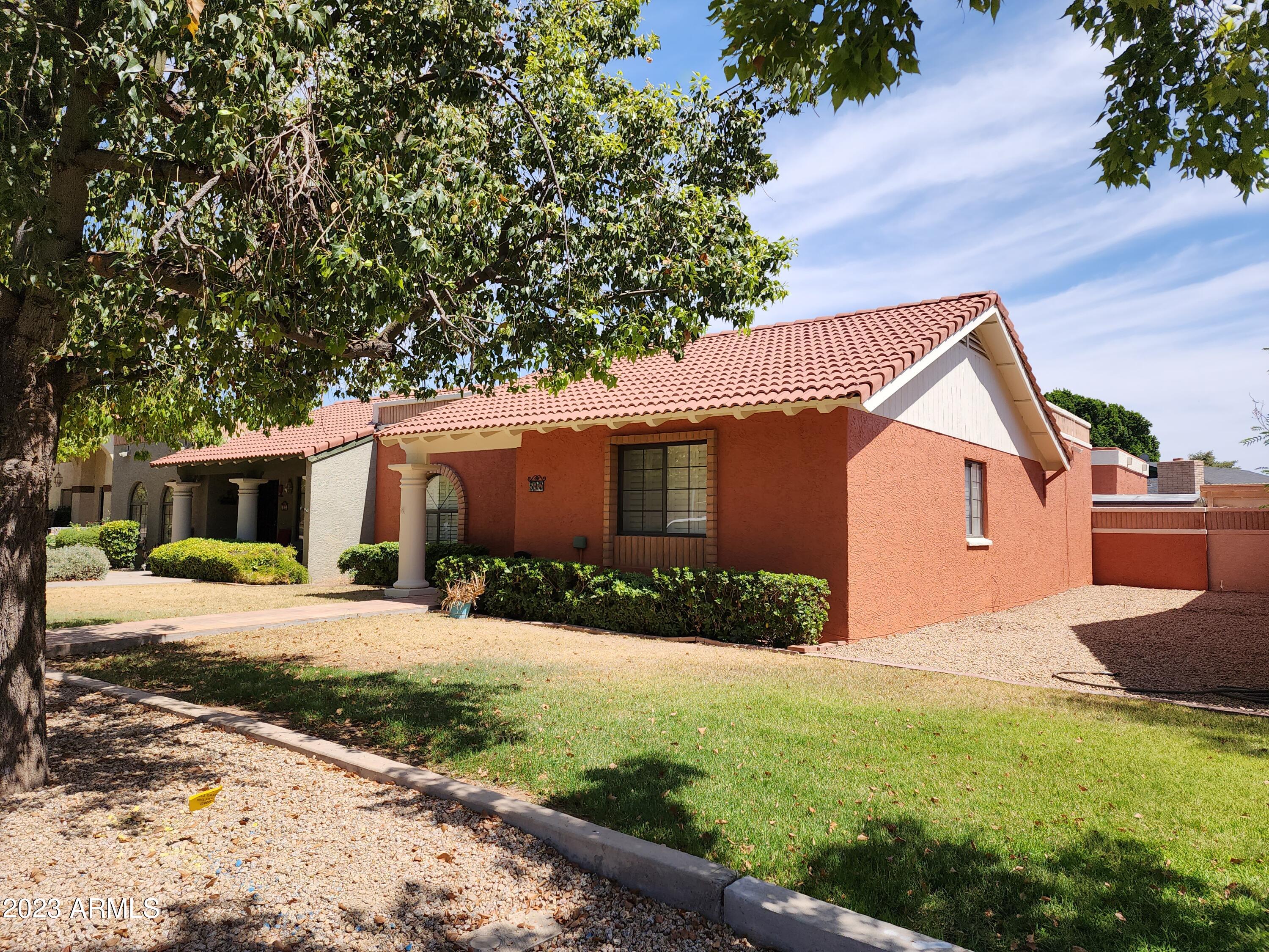 517 West Knox Road Chandler, AZ 85225 - Photo 13 of 14 a front view of a house with a yard and garage