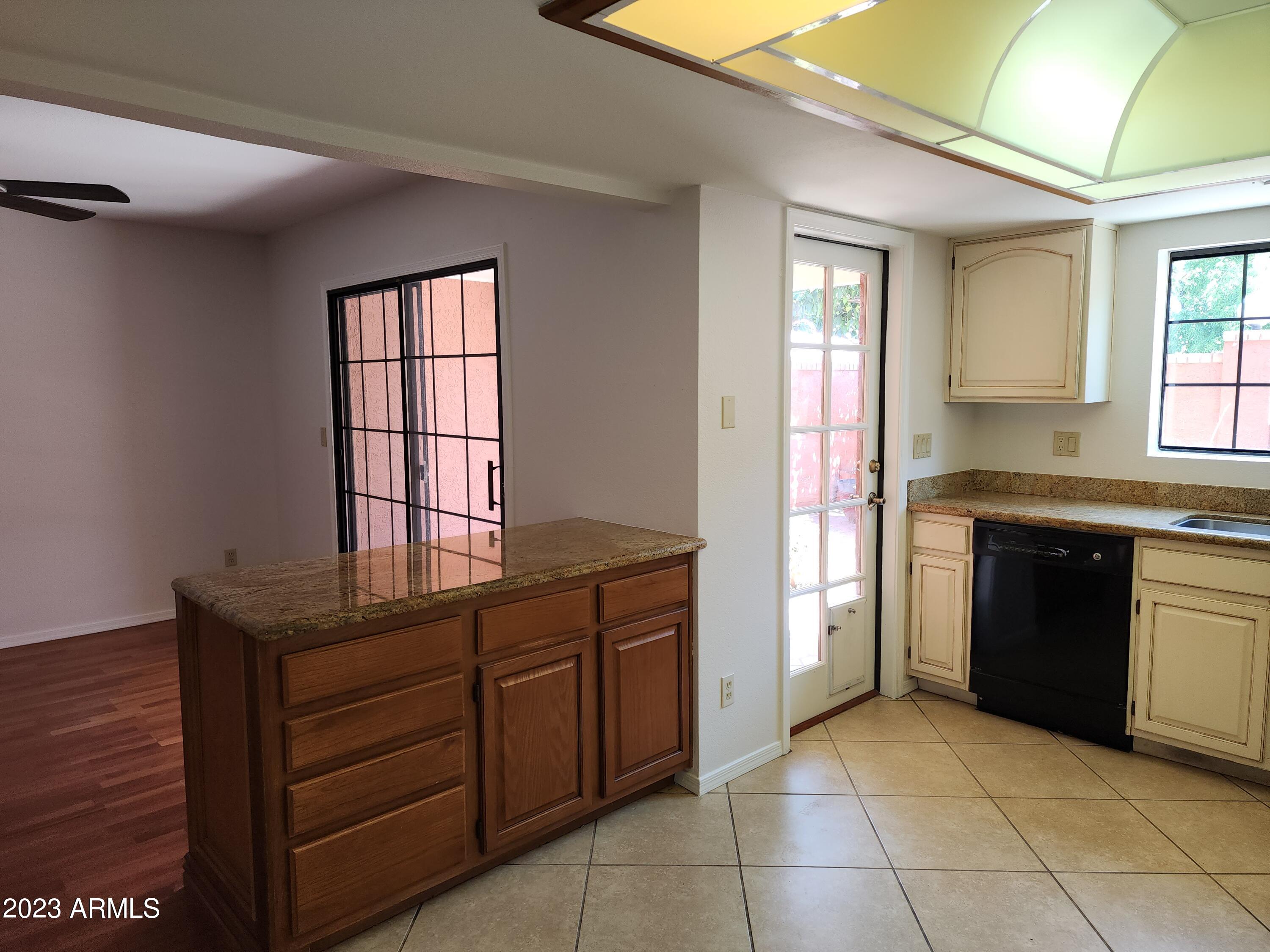 517 West Knox Road Chandler, AZ 85225 - Photo 9 of 14 a kitchen with a stove and a sink
