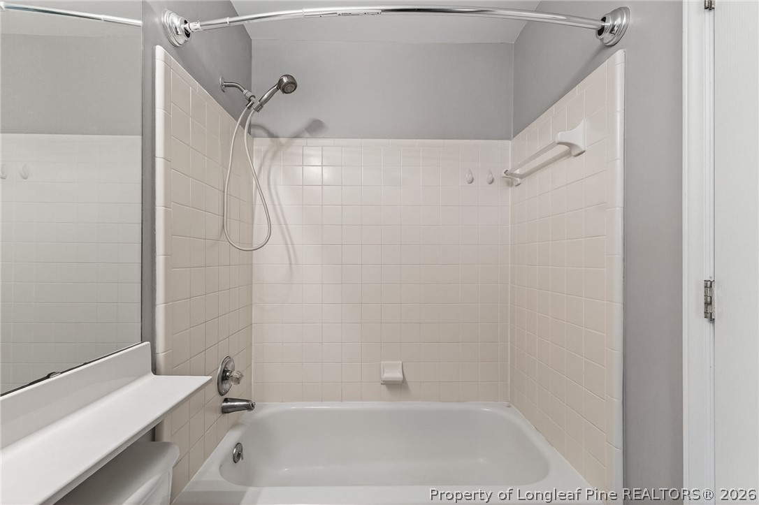 1221 Westview Lane, Unit 301 Raleigh, NC 27605 - Photo 21 of 32 a bathroom with a bathtub and a shower