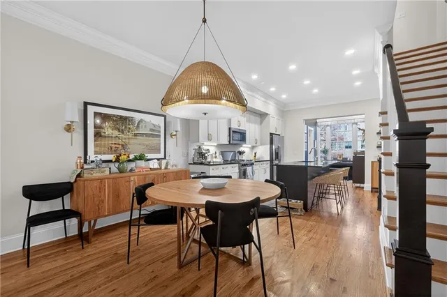 a view of a dining room with furniture window and wooden floor