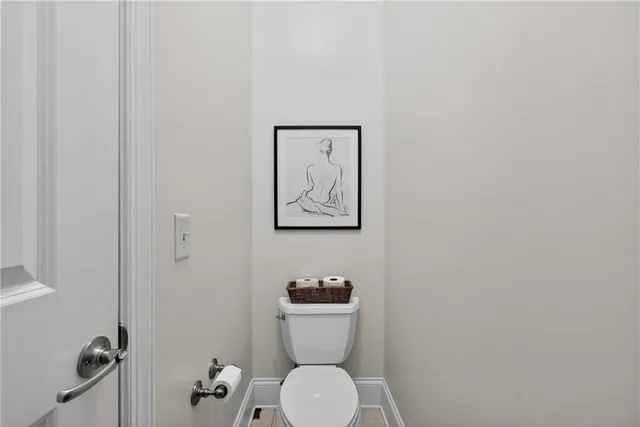 a bathroom with a toilet and a sink