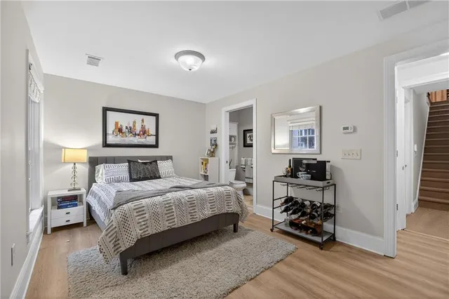 a bedroom with a bed and a dresser