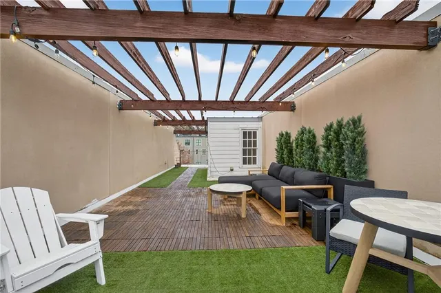 a balcony with chairs and table