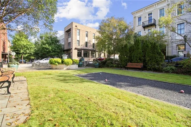a view of a swimming pool with a house in the background