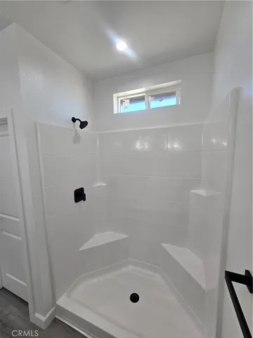 a bathroom with a double vanity sink and mirror