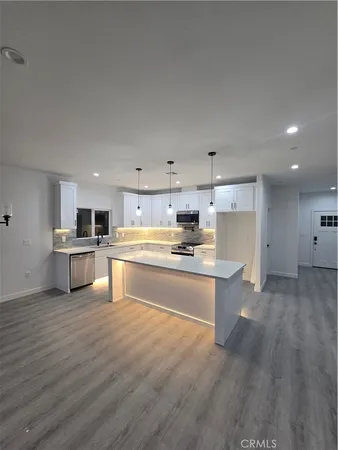 a view of kitchen with wooden floor