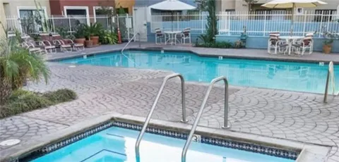 a view of a chairs and table in the patio