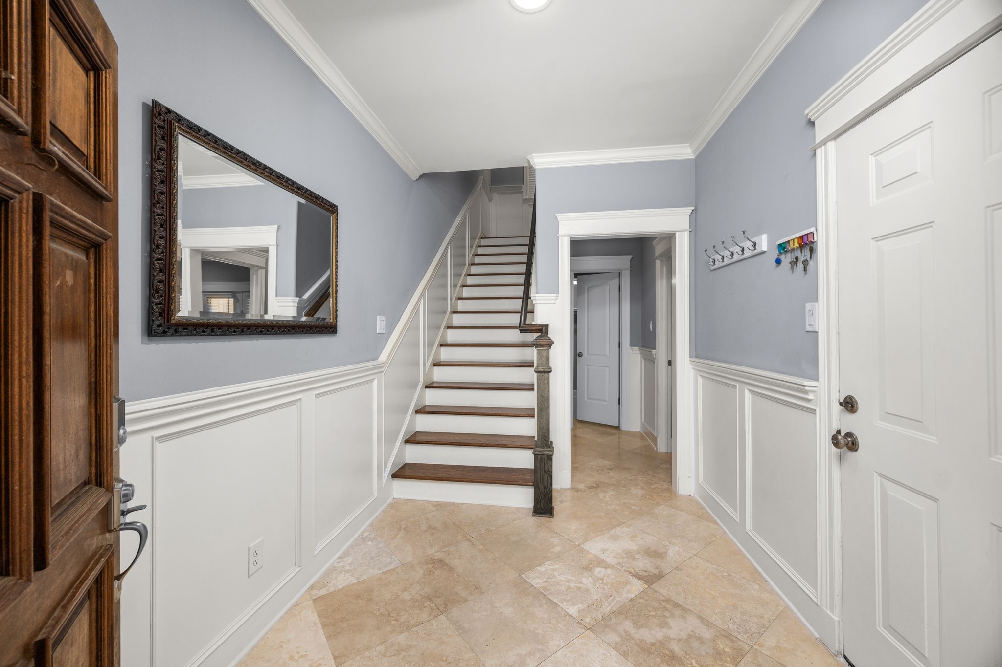 619 Rutland Street, Unit B Houston, TX 77007 - Photo 4 of 33 a view of a hallway to a bedroom with stairs
