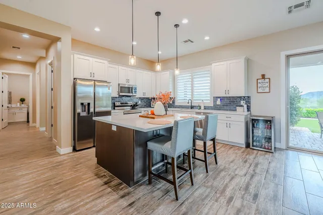 a kitchen with a sink and a counter top space