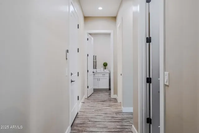 a bedroom with a large bed and a ceiling fan
