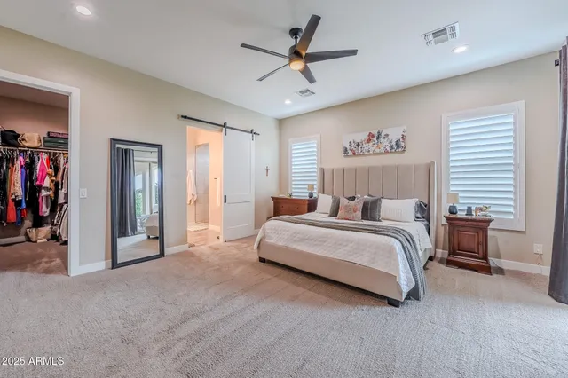 a bathroom with a double vanity sink and mirror
