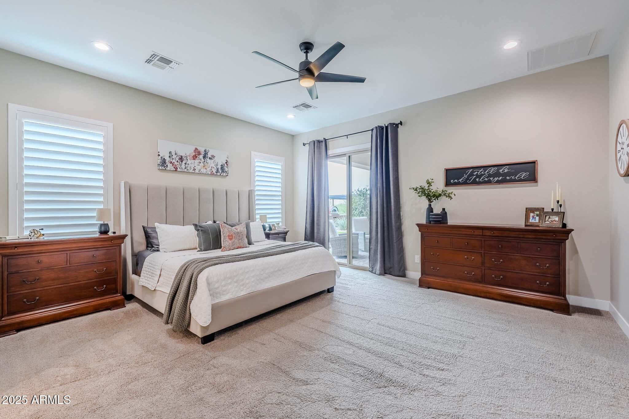 2049 East Gaffney Road New River, AZ 85087 - Photo 27 of 77 a spacious bedroom with a bed and a window
