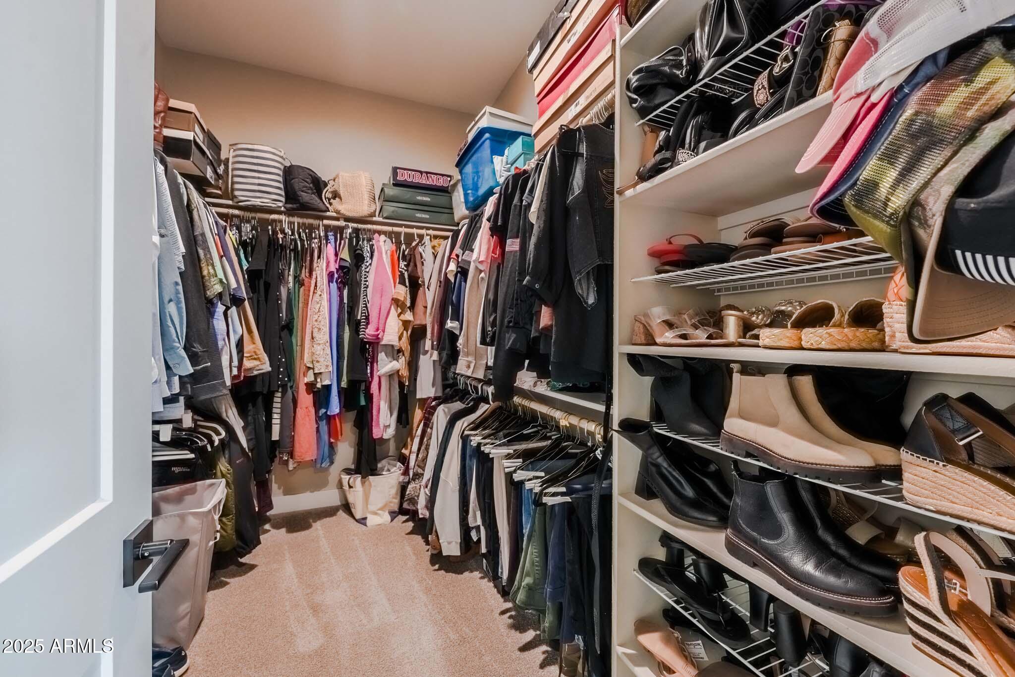 2049 East Gaffney Road New River, AZ 85087 - Photo 28 of 77 a view of walk in closet with clothes and shoes