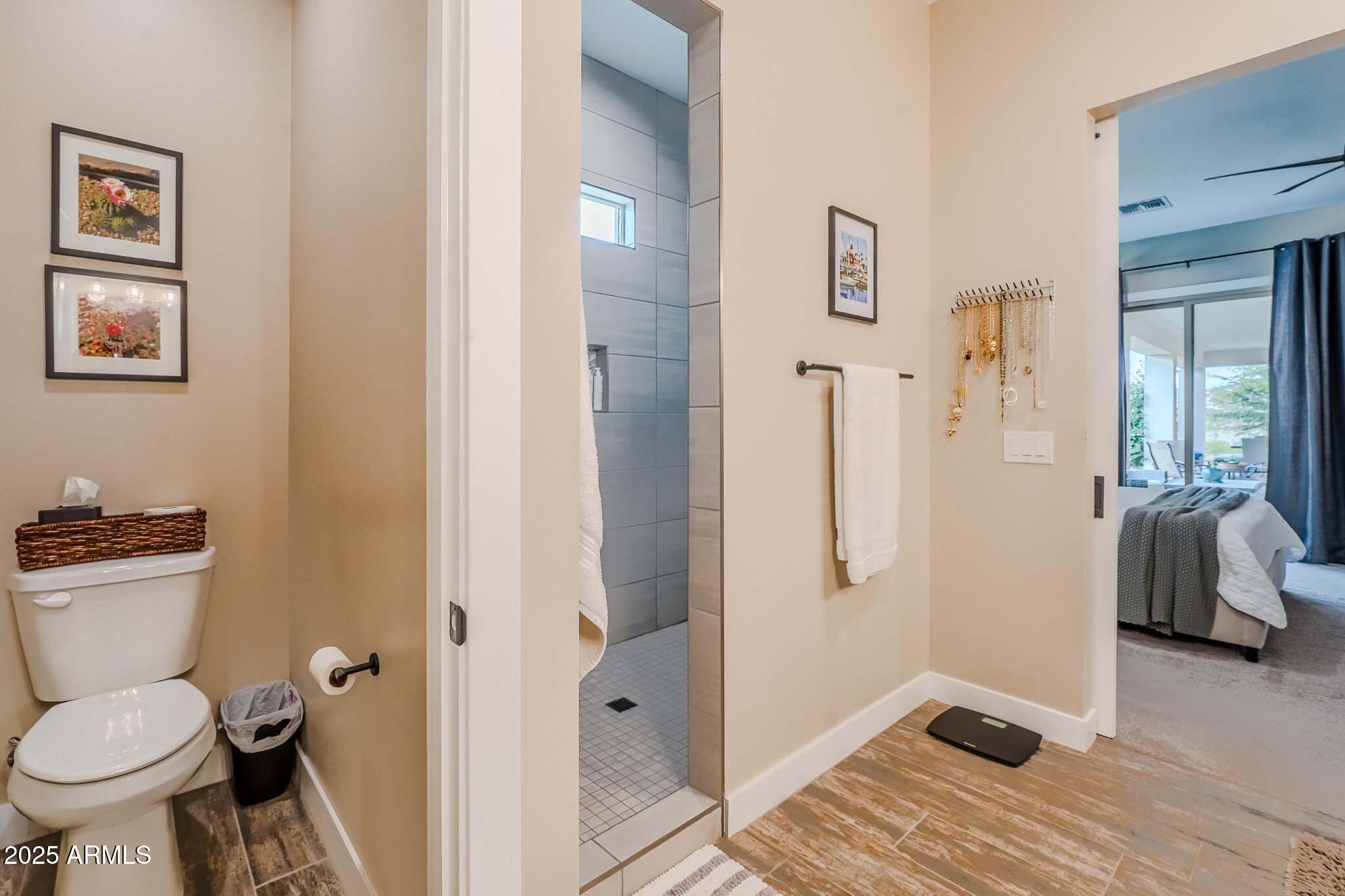2049 East Gaffney Road New River, AZ 85087 - Photo 30 of 77 a bathroom with a toilet and a shower